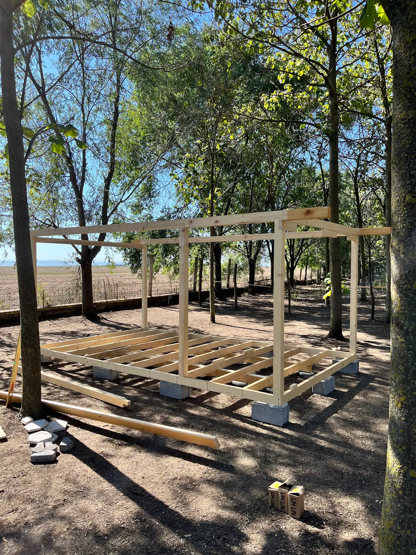 bright wooden garden cabin under trees after construction - Zmajevo - frame 4