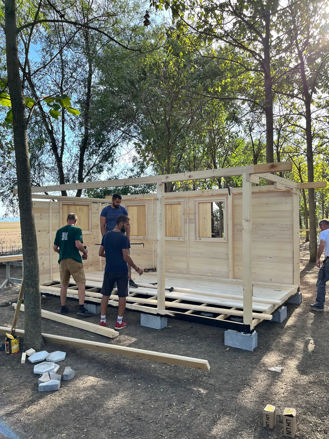 bright wooden garden cabin under trees after construction - Zmajevo - frame 5
