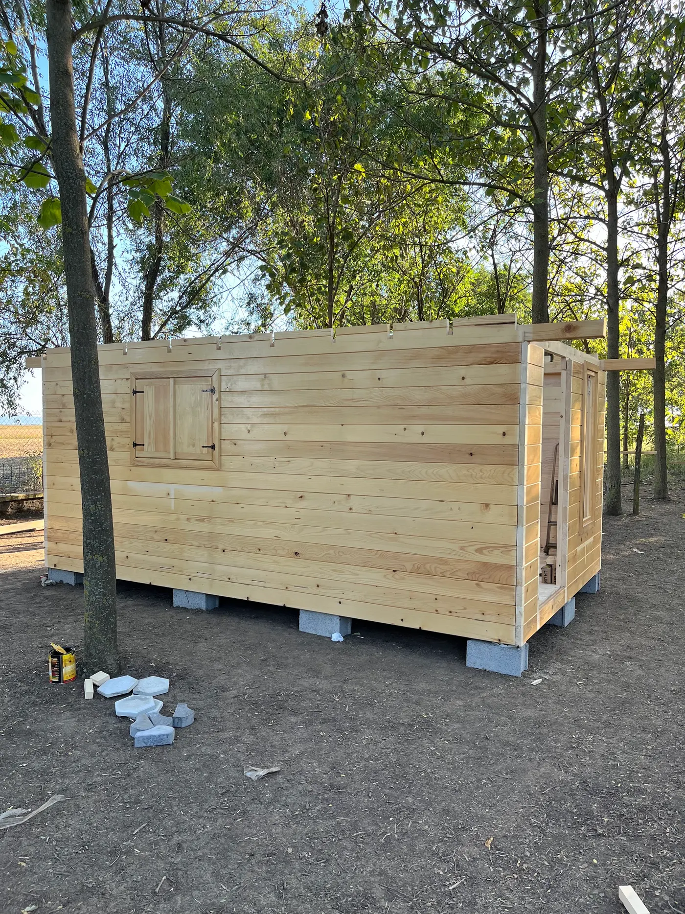 bright wooden garden cabin under trees after construction - Zmajevo - frame 6