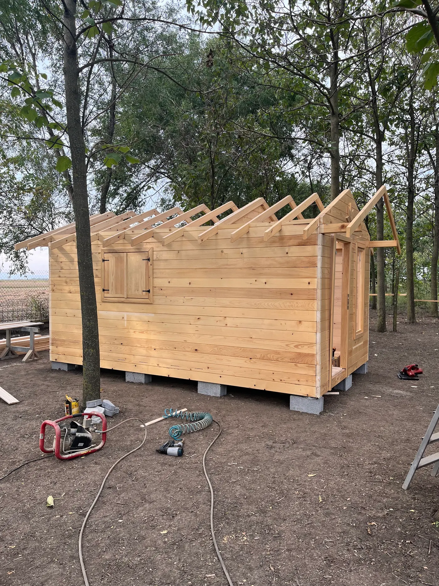 bright wooden garden cabin under trees after construction - Zmajevo - frame 8