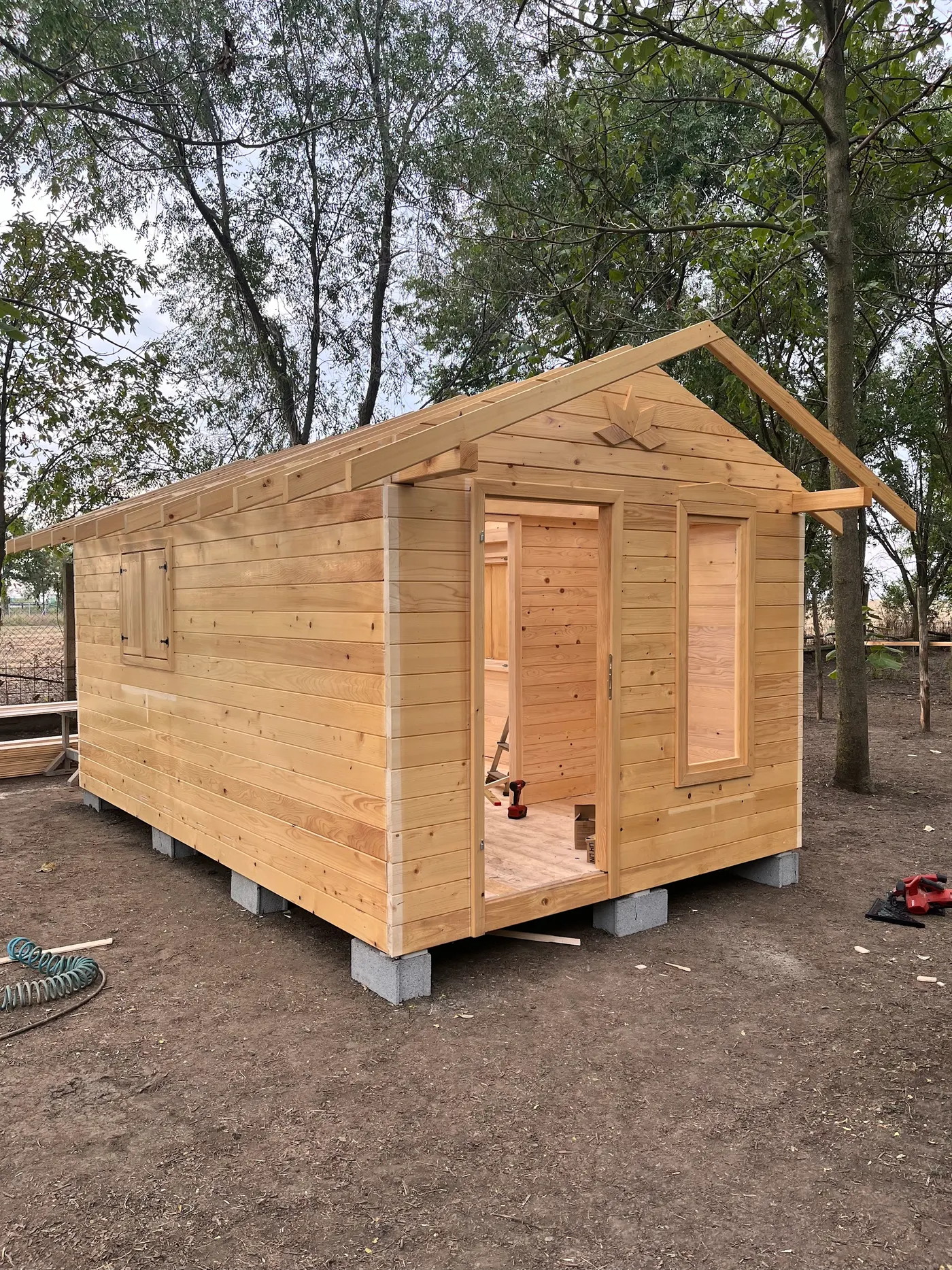 bright wooden garden cabin under trees after construction - Zmajevo - frame 11