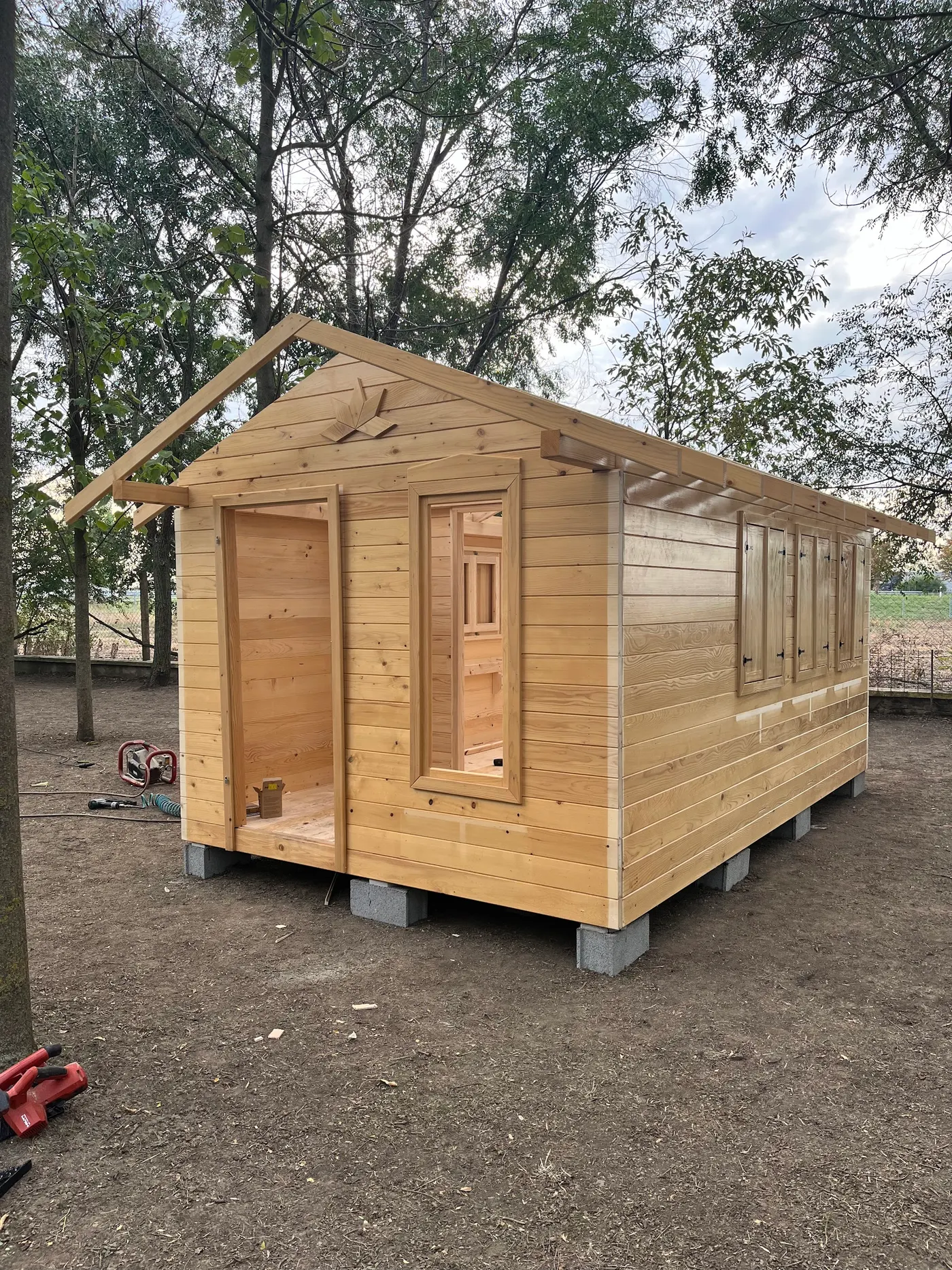 bright wooden garden cabin under trees after construction - Zmajevo - frame 12