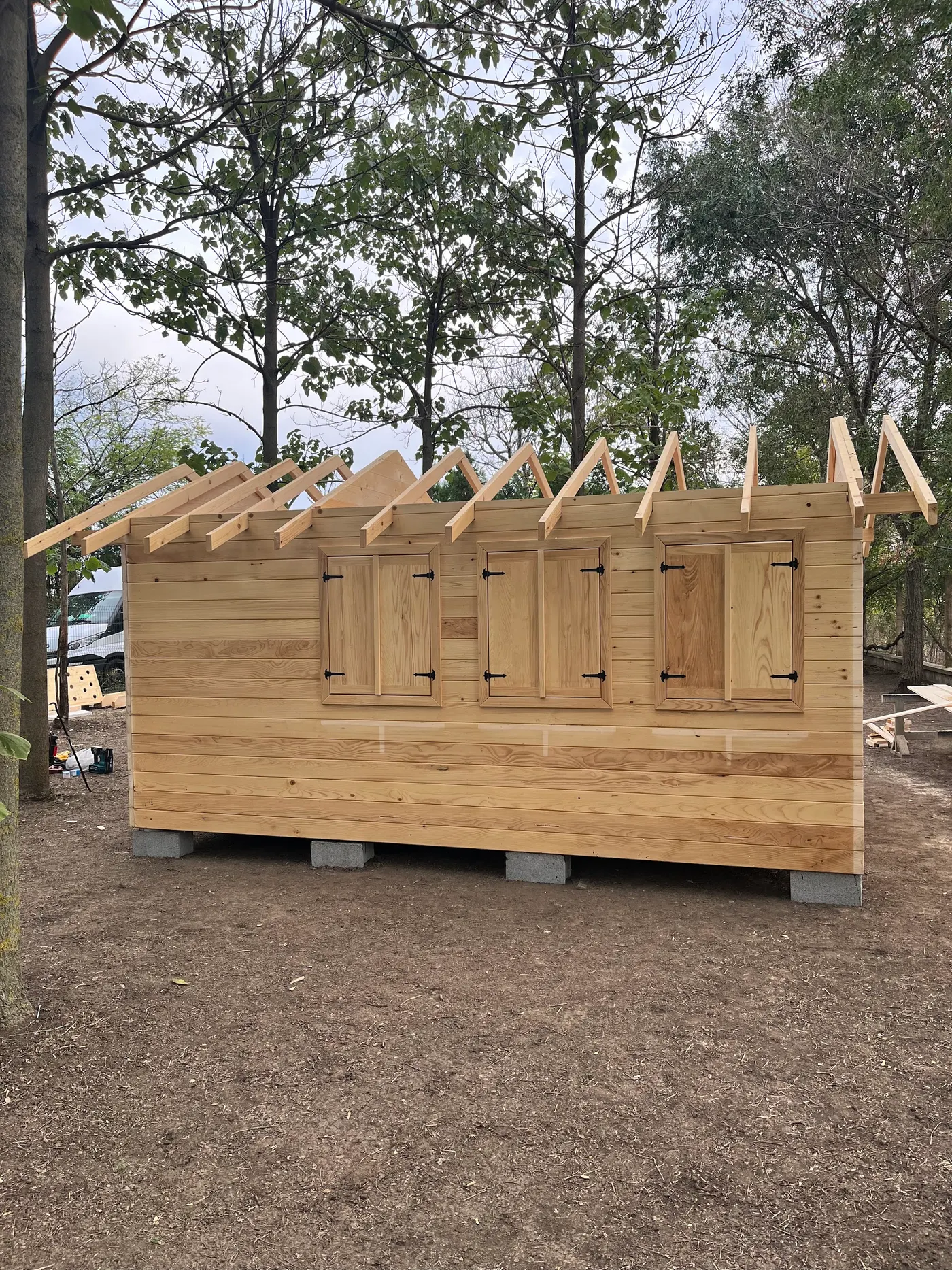bright wooden garden cabin under trees after construction - Zmajevo - frame 14