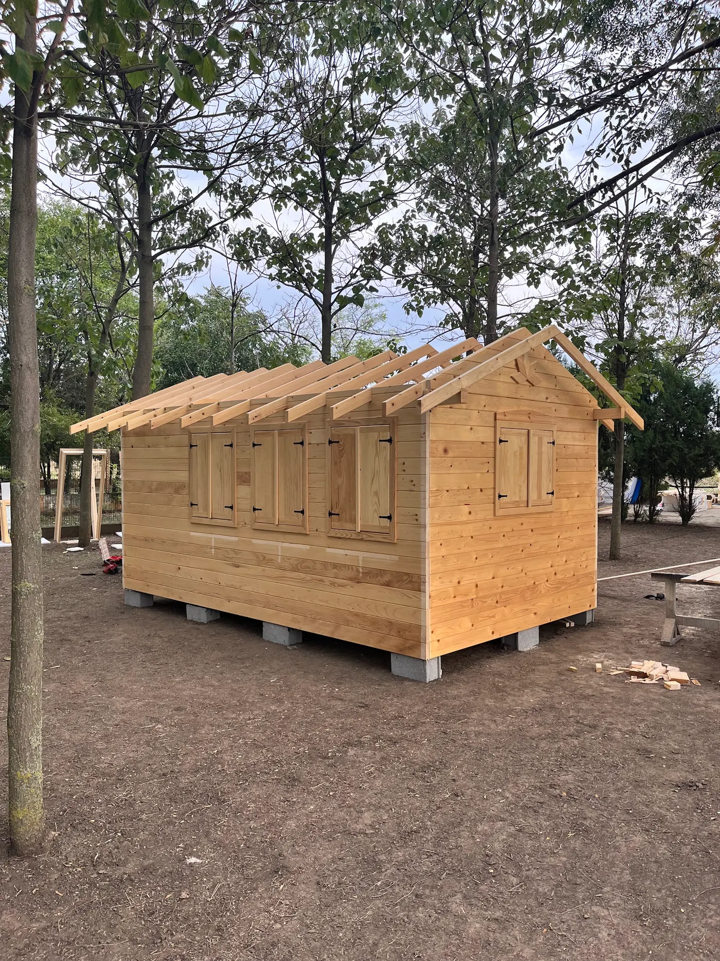 bright wooden garden cabin under trees after construction - Zmajevo - frame 15