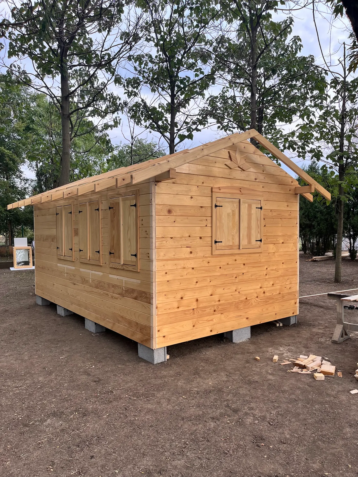 bright wooden garden cabin under trees after construction - Zmajevo - frame 16