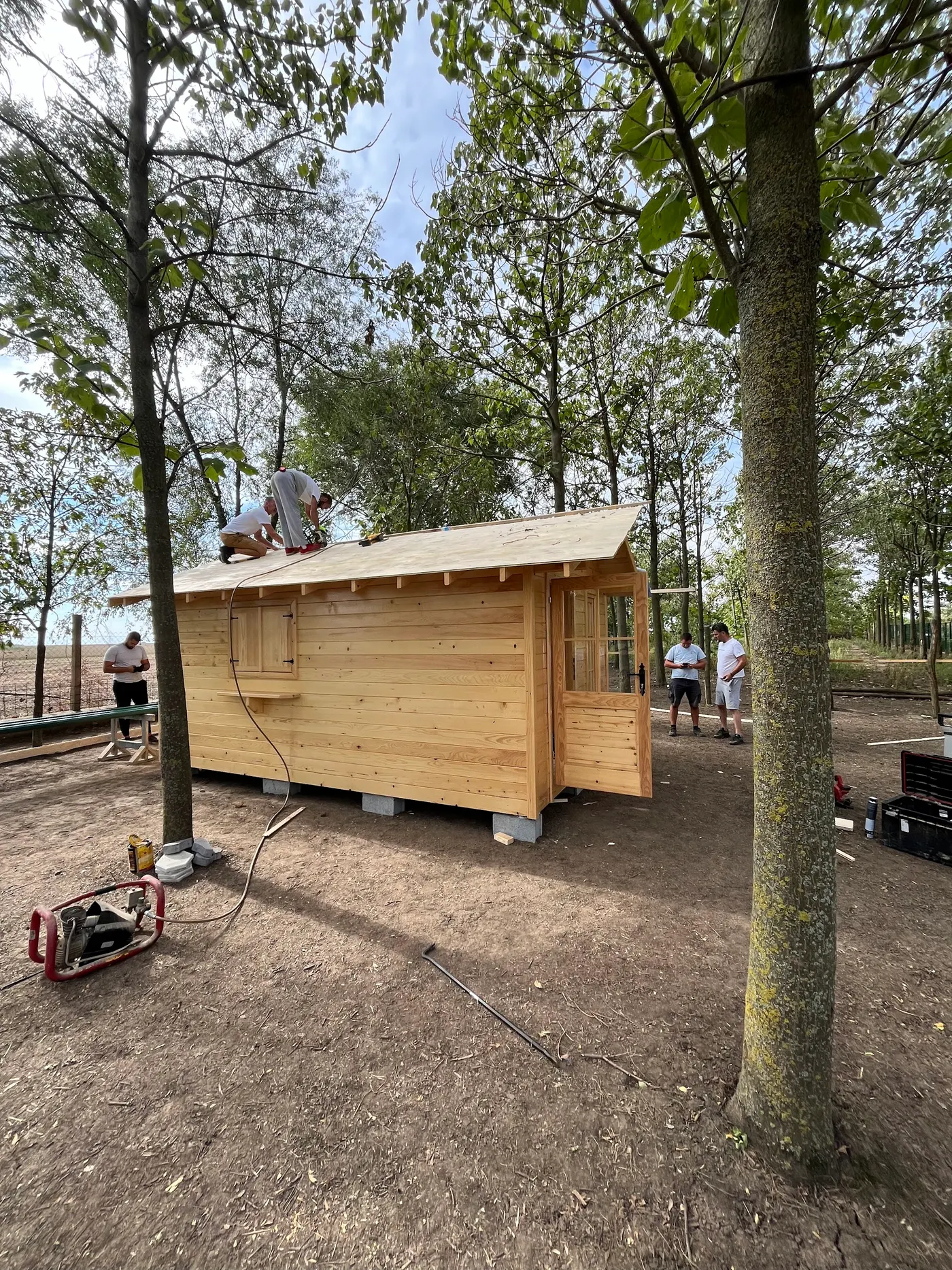 bright wooden garden cabin under trees after construction - Zmajevo - frame 21