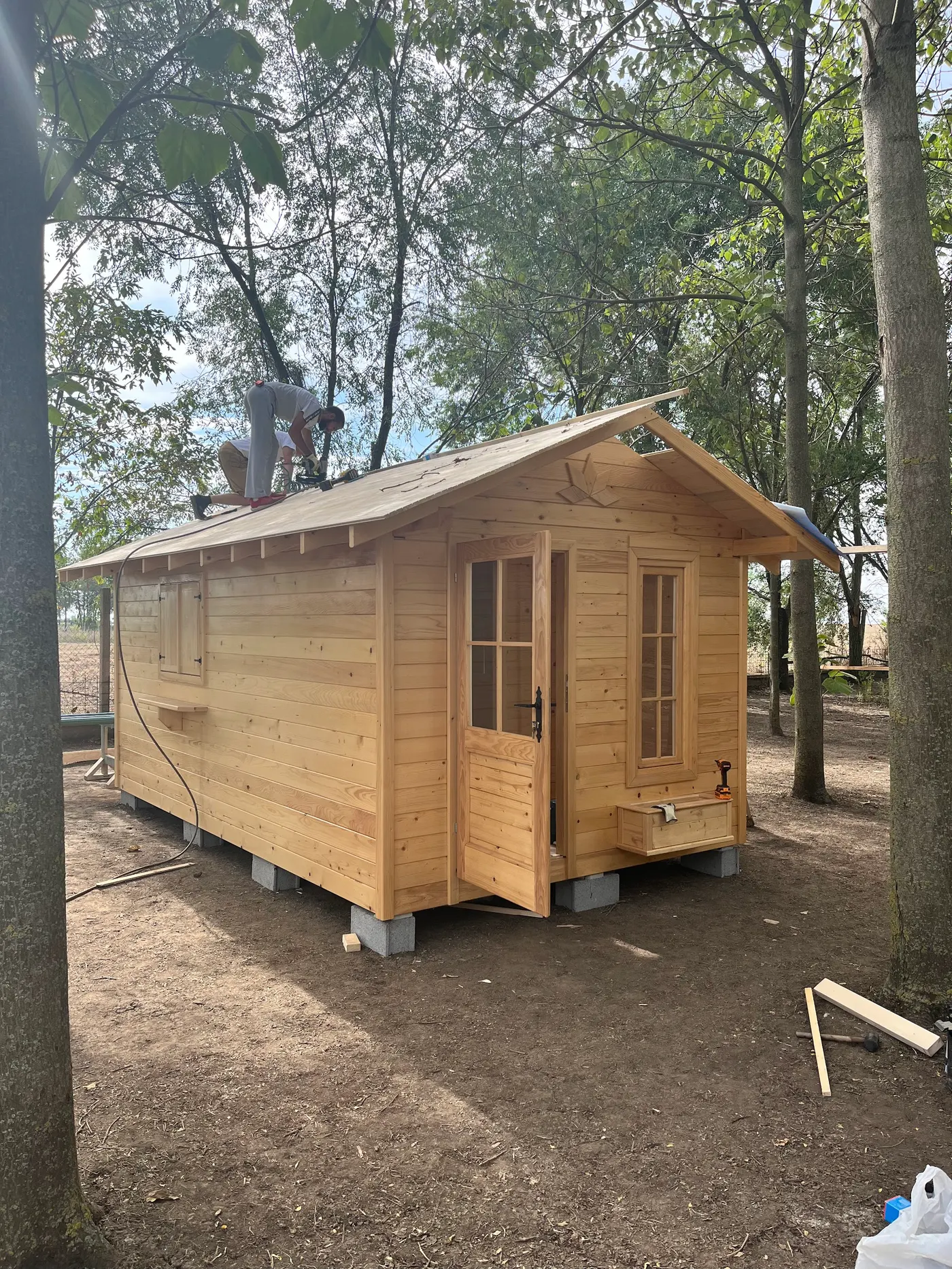 bright wooden garden cabin under trees after construction - Zmajevo - frame 23