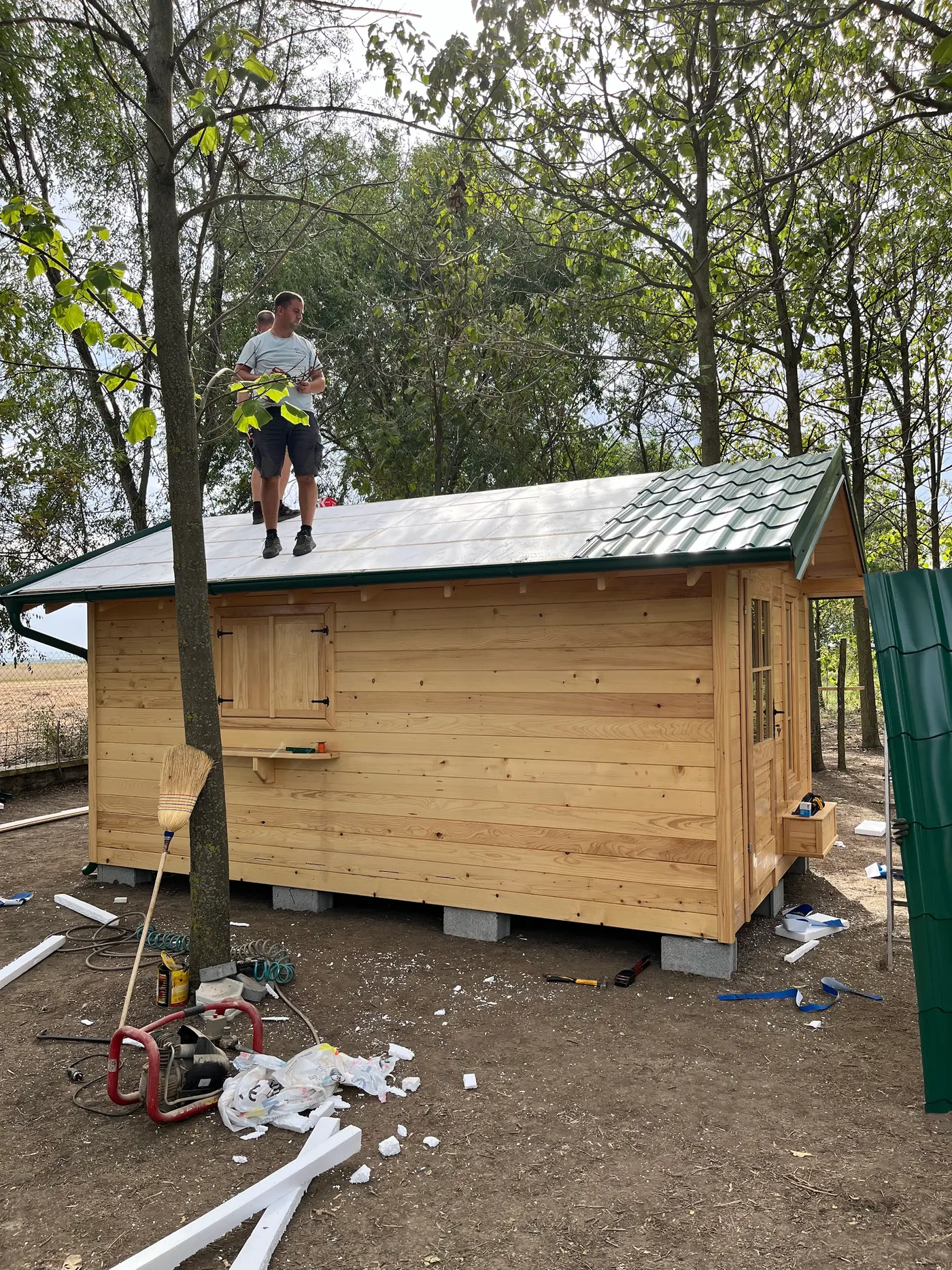 bright wooden garden cabin under trees after construction - Zmajevo - frame 25