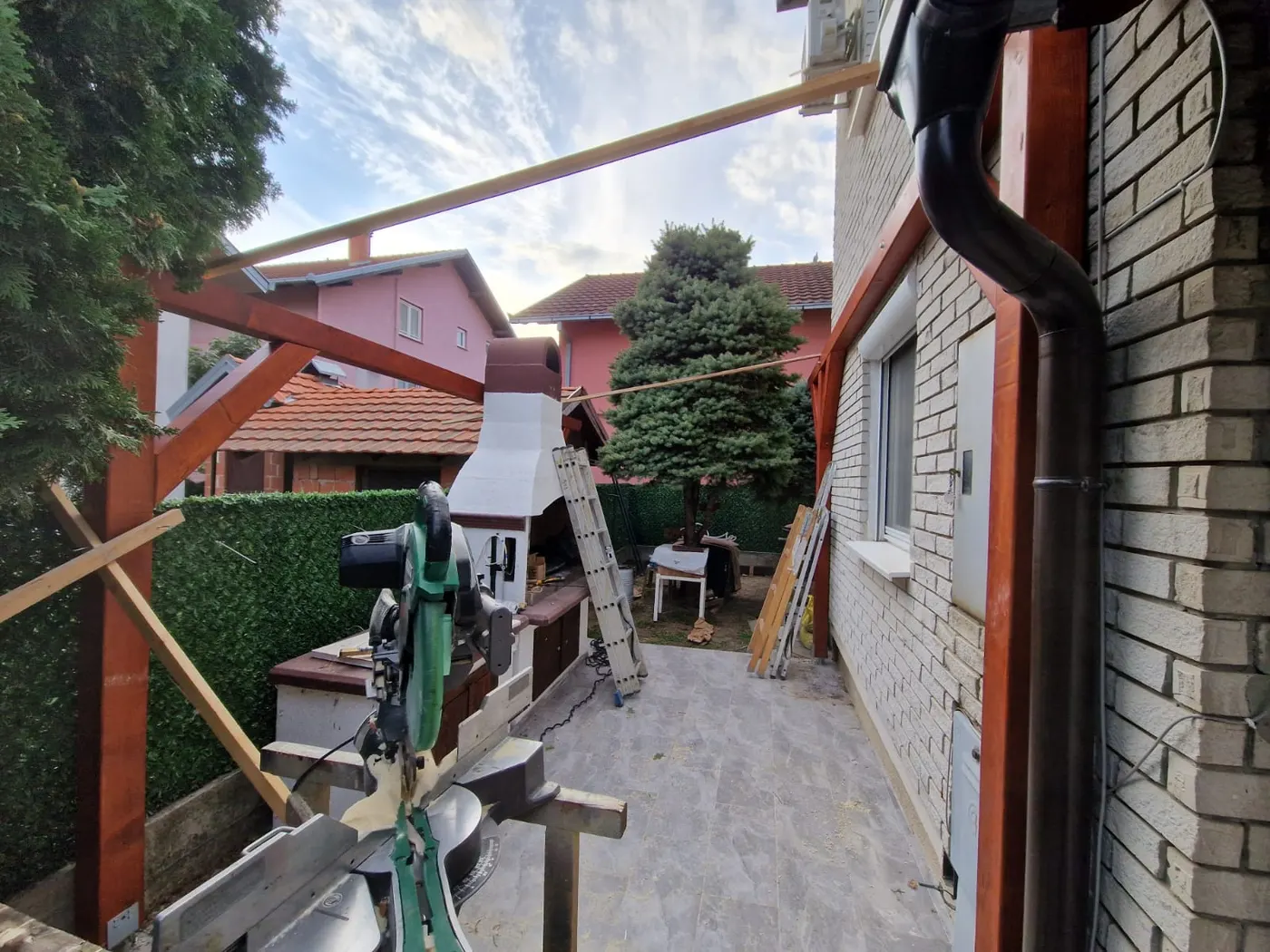 finished wooden canopy in a tidy backyard - frame 1