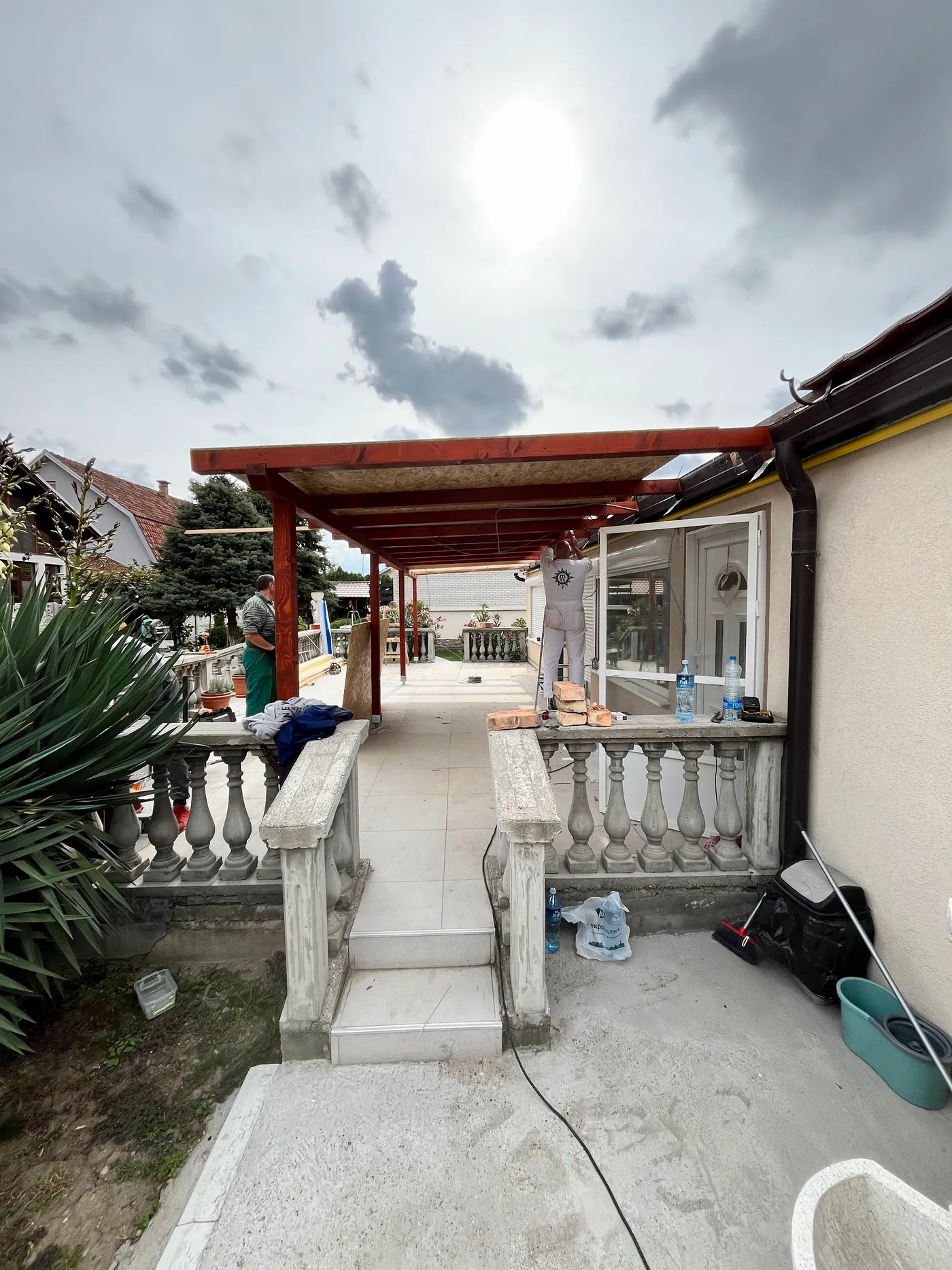 finished wooden canopy in a tidy backyard - frame 12