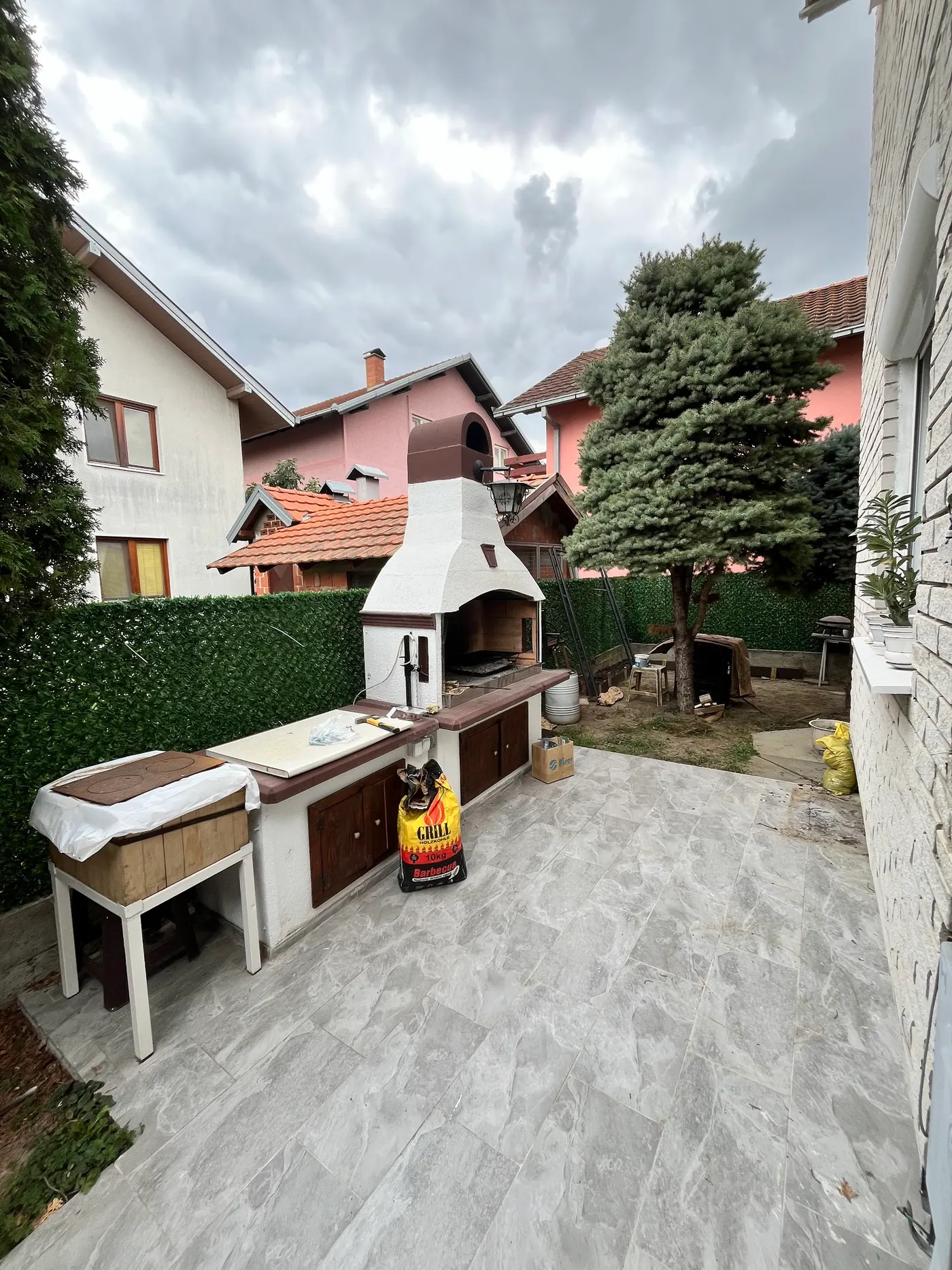 finished wooden canopy in a tidy backyard - frame 14