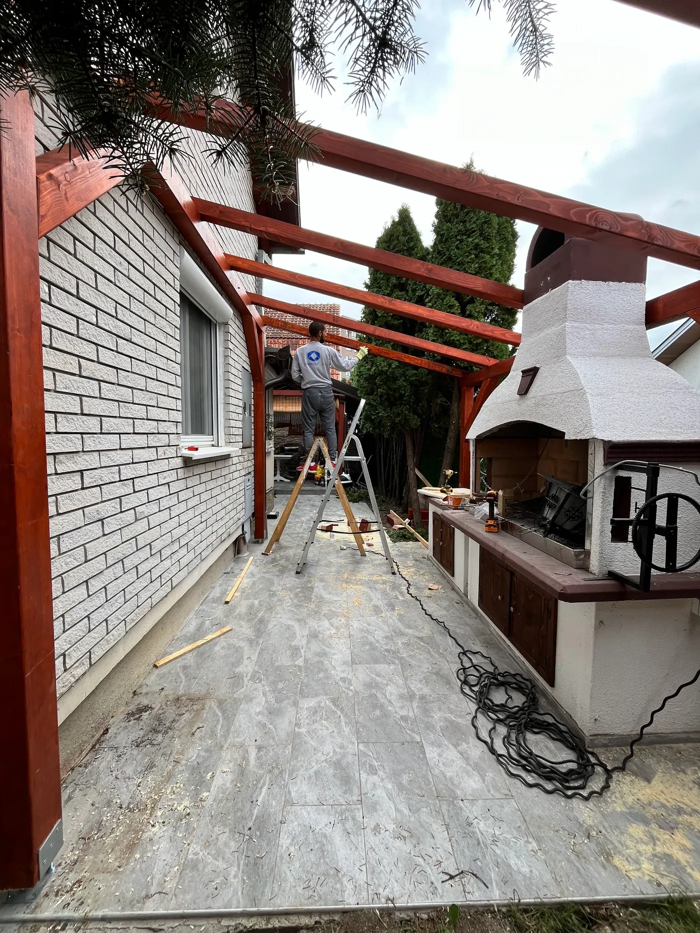 finished wooden canopy in a tidy backyard - frame 20