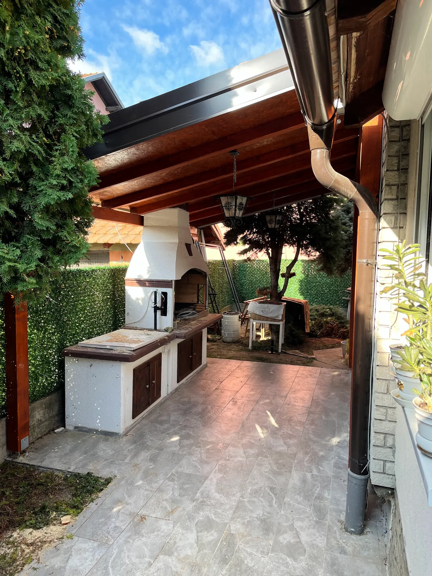 finished wooden canopy in a tidy backyard - frame 23